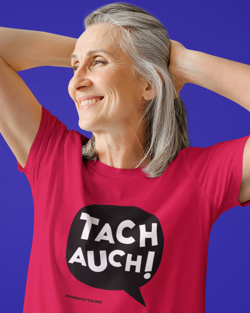 T-Shirts mit charmantem Ruhrpott-Dialekt „Tach auch!“, plakativ designt für Fans von klaren, grafischen Motiven.