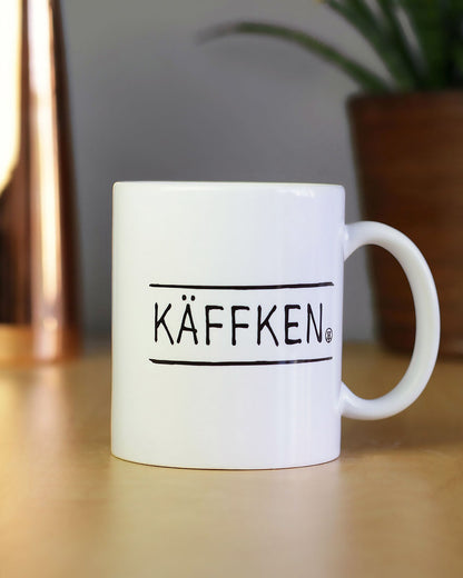 Robuste Keramiktasse mit Ruhrpott-Spruch, perfekt für Kaffee, Tee oder als Geschenkidee.